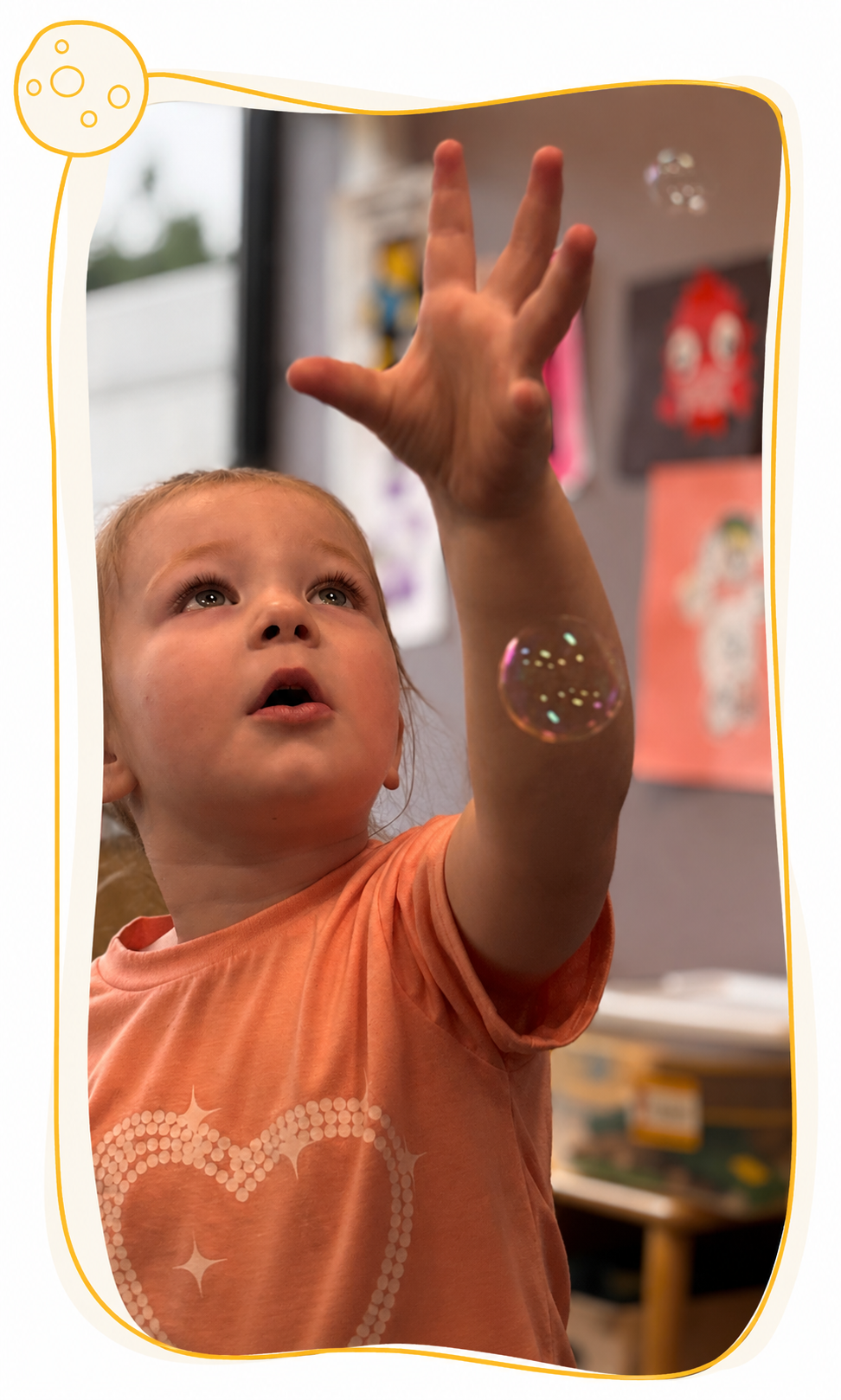 Center Based Kiddo playing with bubbles